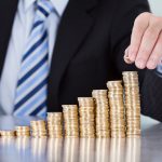 dca-businessman-coins-stack